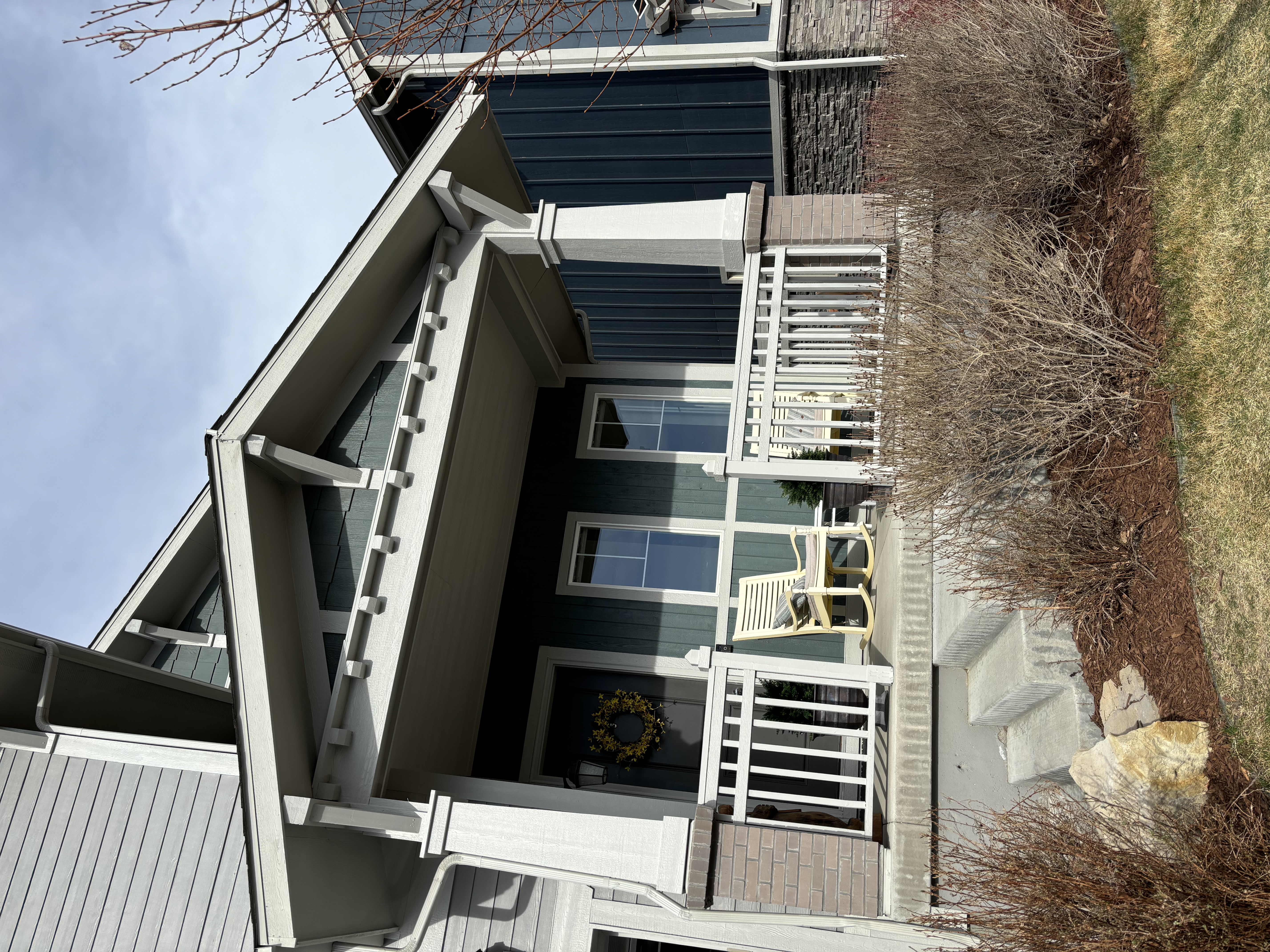 Fresh exterior paint on front porch and siding